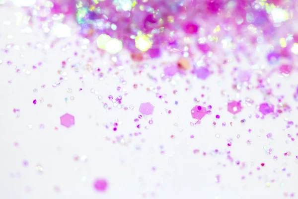 Pink Sparkling Glitter on White Background Bokeh Abstract Close Up