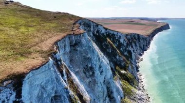 Experience breathtaking views of Cap Blanc Nez in France with its dramatic cliffs and azure waters. The landscape reveals the vibrant blend of nature and coastline.