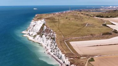 Experience the breathtaking aerial views of Cap Blanc Nez in France, showcasing the white chalk cliffs, lush green landscapes, and the vast blue expanse of the English Channel.