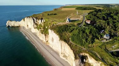 Discover the stunning views of the famous Etretat cliffs in France from above. This aerial perspective highlights the unique rock formations and the serene coastline that attracts visitors year-round.