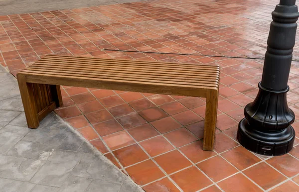 Brown Wood bench on concrete floor
