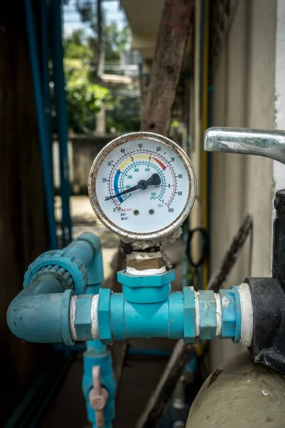 Water pressure gage on blurred pipe background — Stock Image Water Pressure Gage Blurred Pipe Background Stock Image