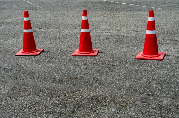 Three Orange Plastic Cones Asphalt Road Stock Photo