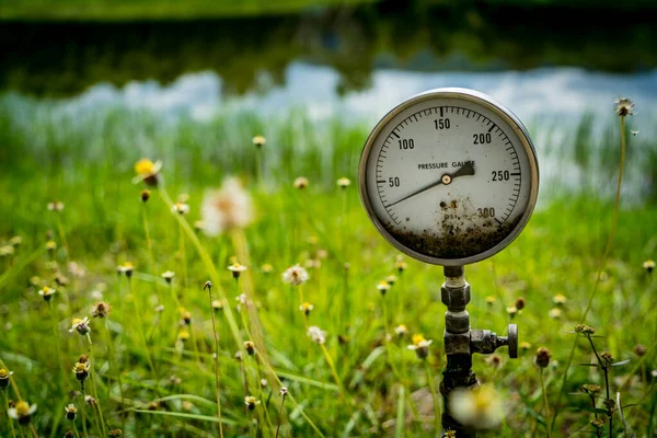 Water pressure gauge on green nature background — Stock Image Water Pressure Gauge Green Nature Background Stock Image