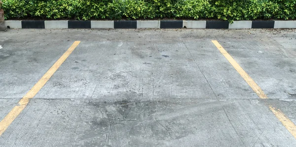 Yellow line on concrete car park