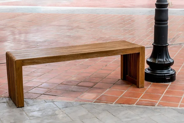 Brown Wood bench on concrete floor