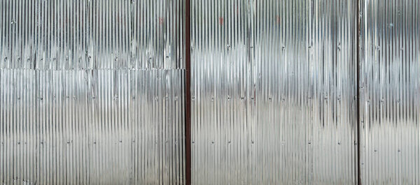 Corrugated metal sheet texture of roller shutter gate