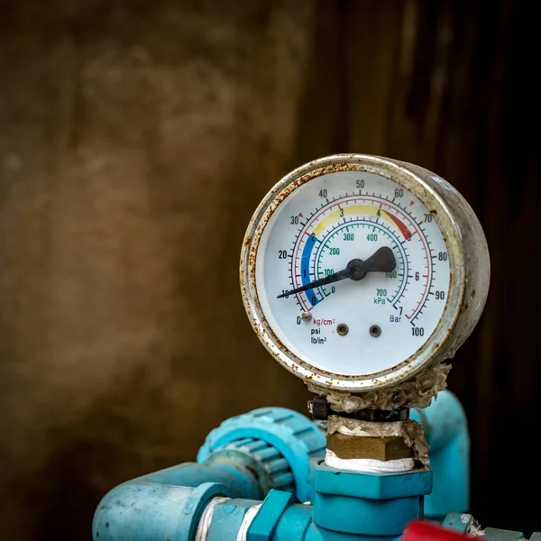 Water pressure gage on blurred pipe background — Stock Image Water Pressure Gage Blurred Pipe Background Royalty Free Stock Images