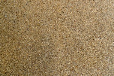 Kahverengi çimento 'nun küçük çakıl desenli yakın plan görüntüsü