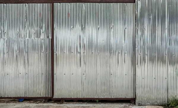 Corrugated metal sheet roller shutter gate