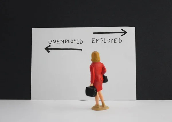 Employed or unemployed options with arrows. Little woman stand and thinking about future. — Stock Photo, Image