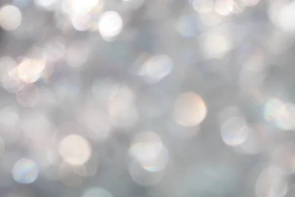 Zilveren licht witte abstracte bokeh Sparkle defocused achtergrond ontwerp — Stockfoto