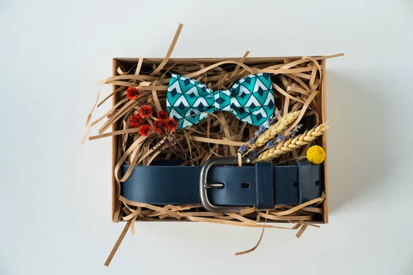 wrapped gift, bow tie and belt, gift for man