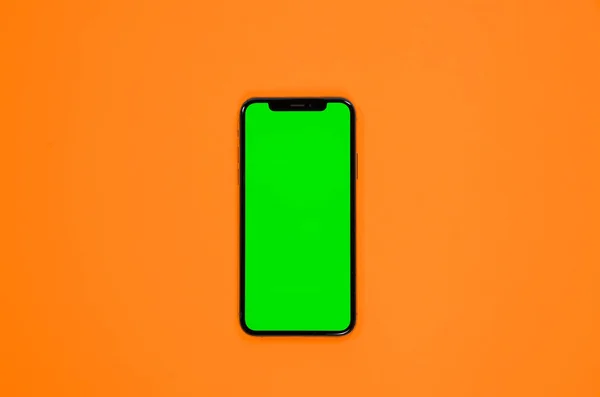 iPhone XS, telefon smartphone, yeşil ekran onorange arka plan