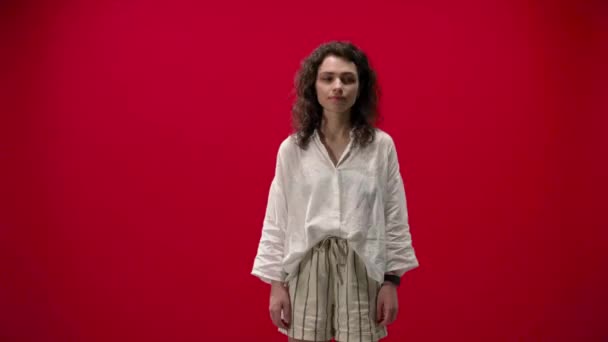 Curly Girl Rejoices Shows Cool Red Background Successful Satisfied — Stock Video