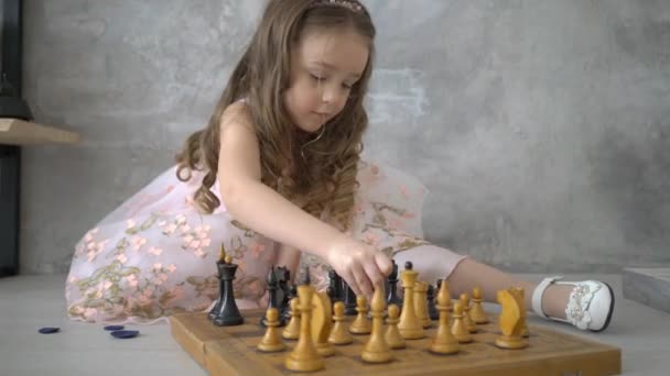 Little Girl Plays Puts Checkmate Chess Game — Stock Video