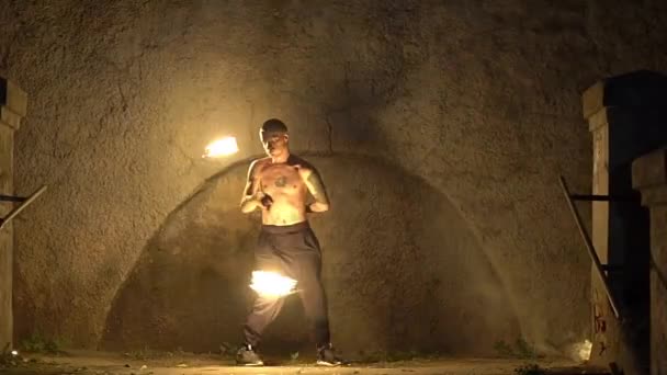 Slow Motion Male Artist Spins Fire Poi Rock — Stock Video
