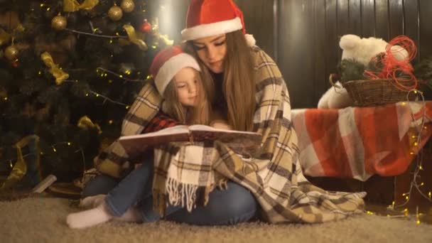 Beautiful Kids Reading Book Sitting Christmas Tree — Stock Video