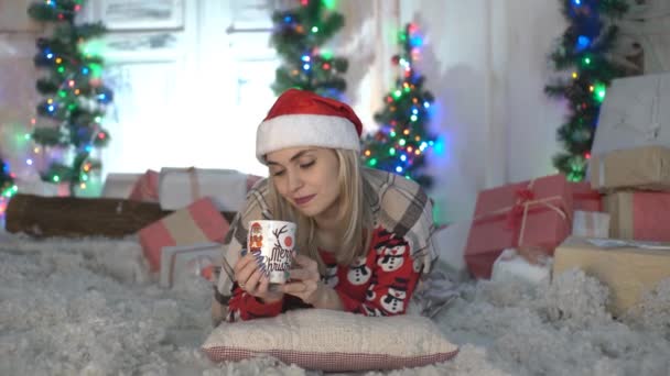 Redhead Girl Sitting Floor Warming Cup Coffee Looking — Stock Video
