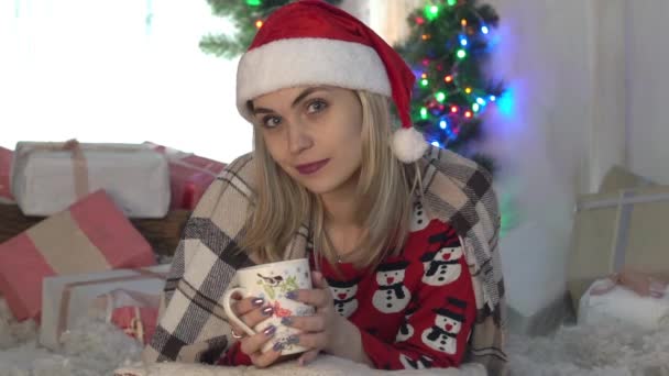 Happy Young Woman Cup Hot Beverage Christmas Tree — Stock Video