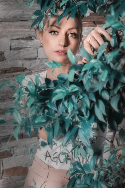 Portrait of a woman among the leaves