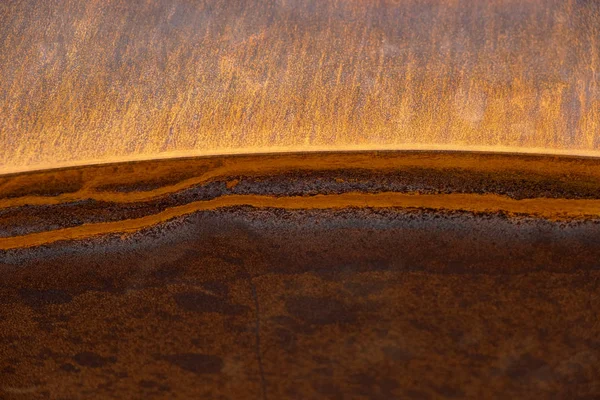 Heavily rusted lines on a sharp edged metal surface