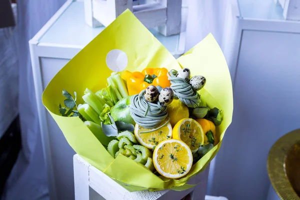 Unique bouquet of fruits and berries. Decorative bouquet of green.