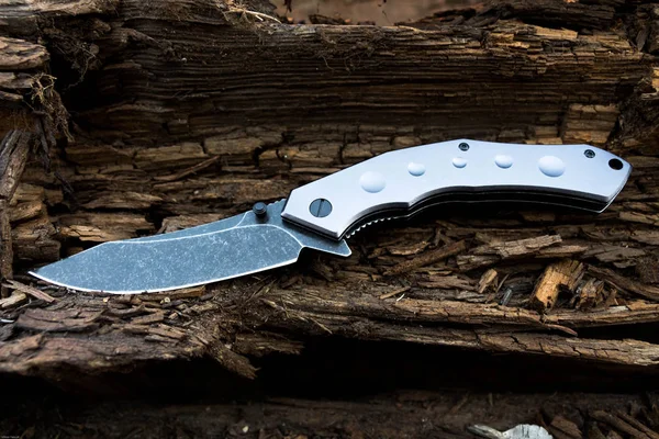 A knife in the form of a wave. Tactical knife.