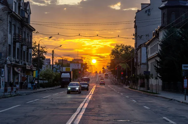 An unusual orange sky over the city. Sunset sun in the city.