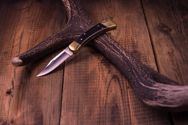 Knife in frame. Folding hunting knife. Cowboy knife. — Stock Photo, Image