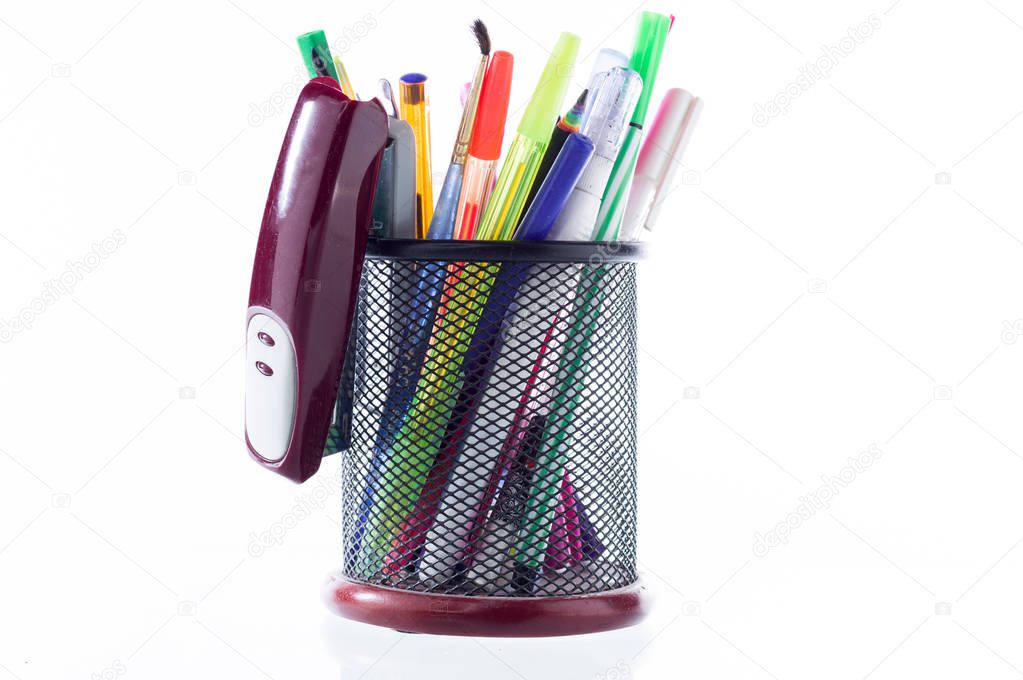 Office glass with pencils and pens. Office of the school. Lots of pens and pencils.