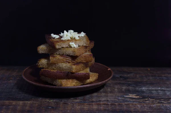 Snack from toast. Sandwich from toasts with garlic. — Stock Image Snack from toast. Sandwich from toasts with garlic. Stock Photo