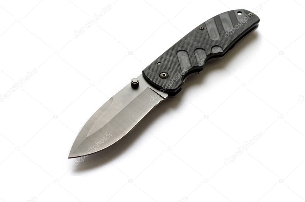 View of the knife from the top at an angle. Black knife on a white background.