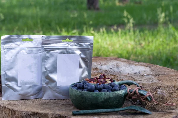 Dry food in packs. Tourist food in thermal packs. Granola from berries and nuts.