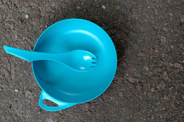 Dishes for tourists. Plastic dishes for hiking. Plate and spoon.