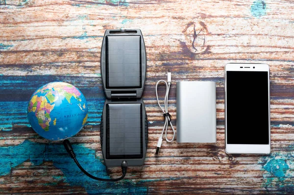 Global energy for devices. Devices and the globe.