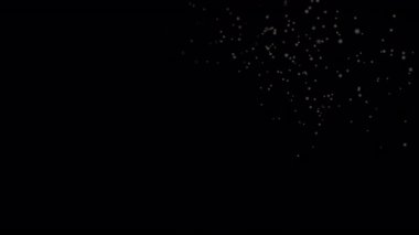 Looping motion graphic of white snowflakes or particles slowly falling down a black screen.