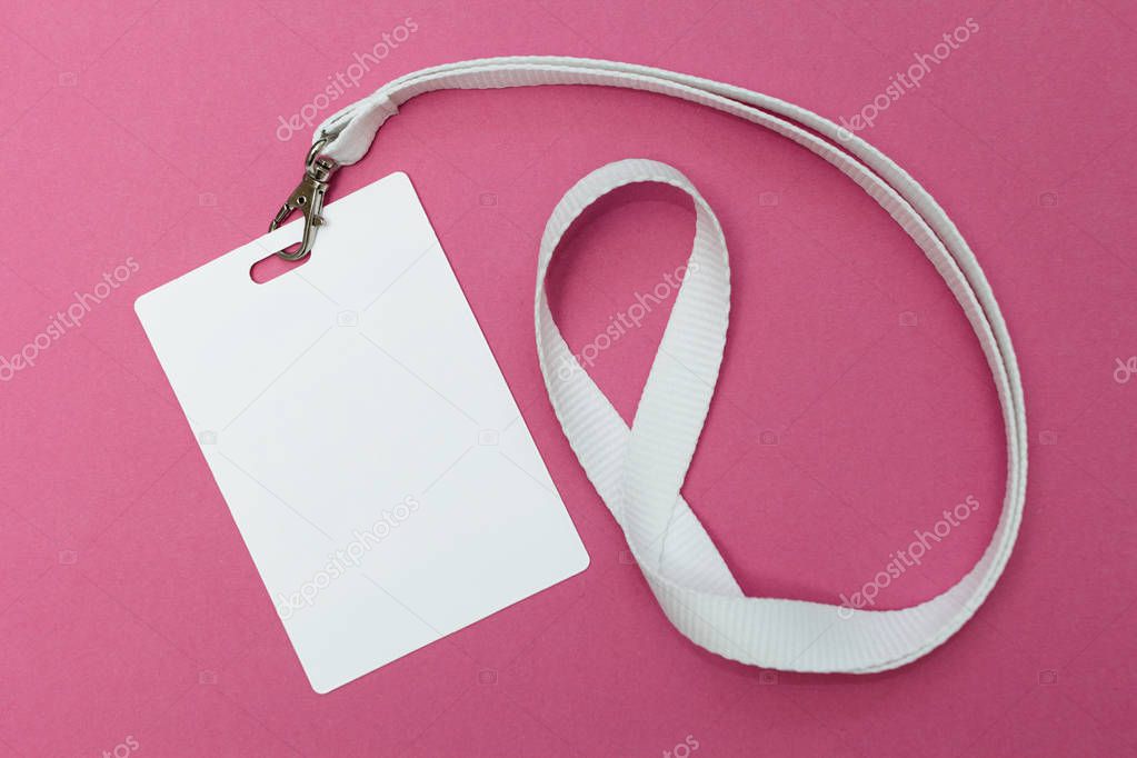 Blank ID card / badge with white belt isolated over pink background. Space for text.