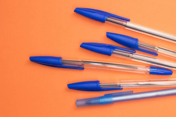 School Accessories Blue Pens Orange Background Stock Photo