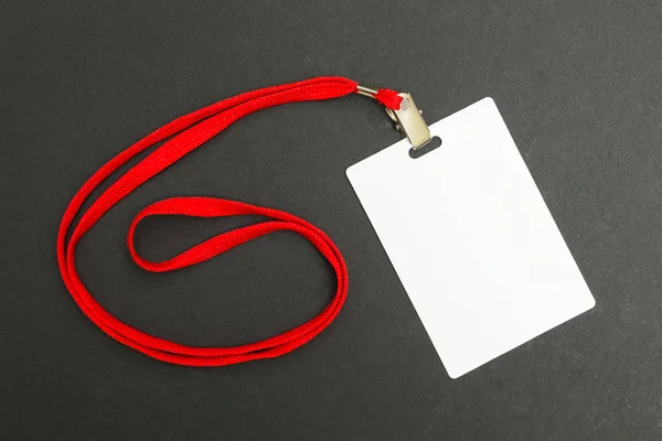 Blank icon with red rope isolated on a black background. Layout.