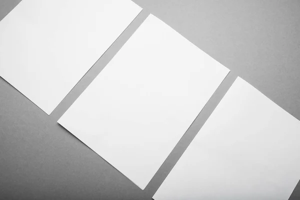 Empty A4 paper on a gray background, a place for design. Mock-up Stock Photo