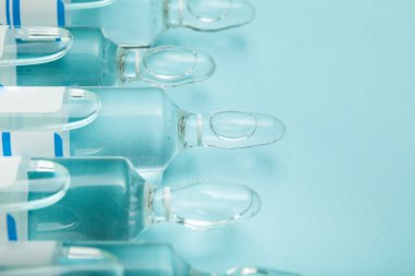 Tıbbi Laboratuar, mavi arka planda ampul grubu.