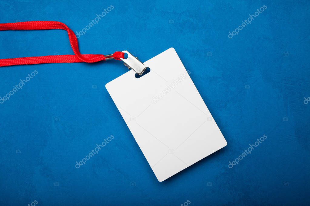 Empty Blank ID card tag isolated on blue background. Mockup.