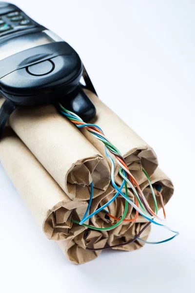 A bomb of dynamite checkers and an old cell phone. — Stock Photo, Image