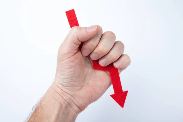 Red arrow in hand, concept of failure. — Stock Photo, Image