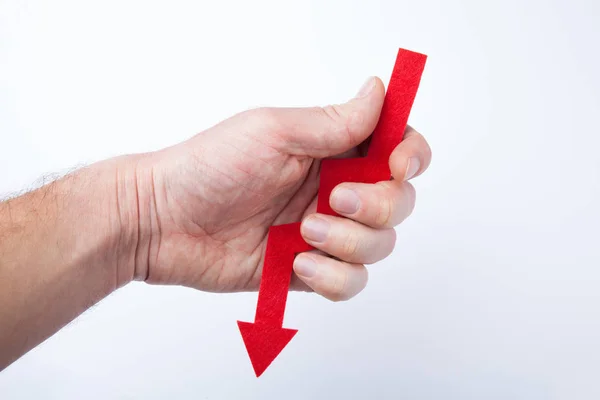 Red arrow in hand as a sign of no luck, isolated on white backgr — Stock Photo, Image
