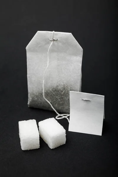 Black tea in a bag of sugar cubes.