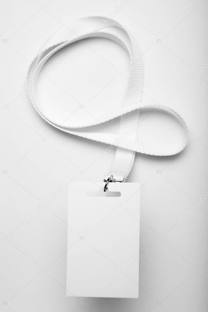 Empty white name tag badge with lanyard, event access.
