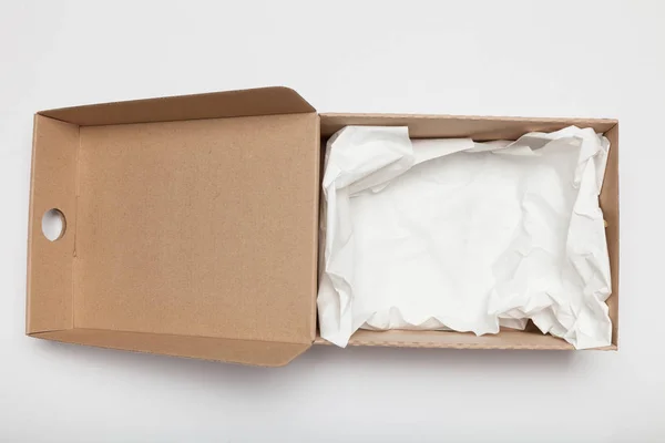 Open delivery carton box, corrugated cardboard. Container packing. Copy space for text. — Stock Photo, Image