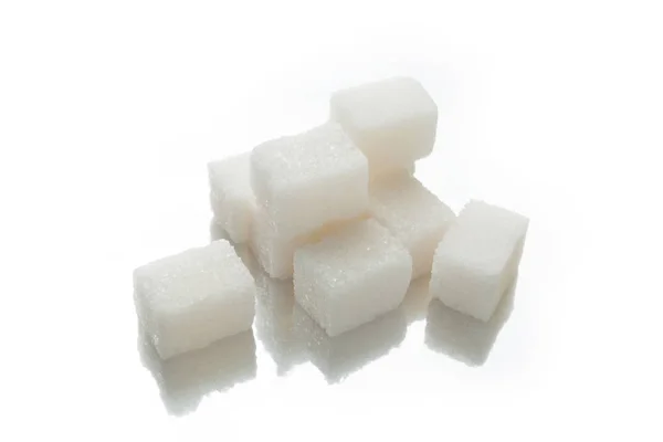 Cubos de açúcar branco cristal, hidratos de carbono . — Fotografia de Stock
